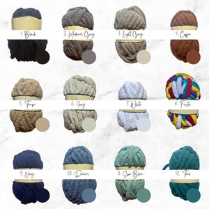 May include: A collection of twelve different colored chunky knit yarn balls. Colors include black, medium gray, light gray, coffee, taupe, ivory, white, fiesta, navy, denim, spa blue, and teal. Each ball has a corresponding color swatch and number.