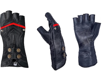 May include: Three black fingerless leather gloves featuring a red horizontal stripe across the knuckles, metallic silver studs, and two circular bronze-toned buttons on the wrist area. The gloves display intricate embossed patterns on the leather surface.