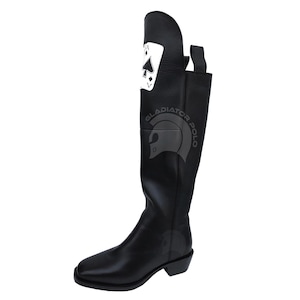 May include: Black leather riding boot with a square toe and a low heel. The boot features a white Ace of Spades card design on the upper shaft. The text "GLADIATOR POLO" is printed on the side.