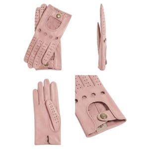 May include: A pair of light pink leather driving gloves featuring perforated detailing on the fingers and knuckles, a cutout on the back of the hand, and a small metallic snap button closure at the wrist for a secure fit and ventilation.
