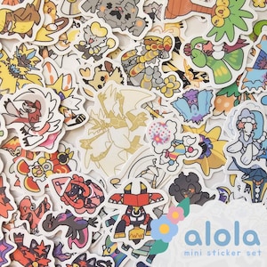 May include: A white ceramic mug with a black handle and the text "But First, Coffee" in a bold, black font. The mug is set against a blurred background, suggesting a cozy setting.