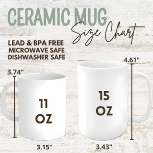 Ceramic mug size chart displaying two white mugs: an 11 oz mug measuring 3.74" tall and 3.15" wide, and a 15 oz mug measuring 4.61" tall and 3.43" wide. Text highlights that the mugs are lead & BPA-free, microwave safe, and dishwasher safe. Rustic wood background with stylish typography.
