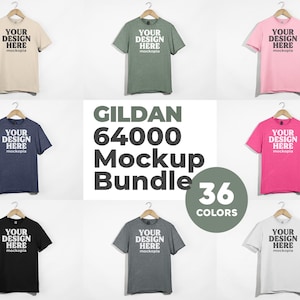 May include: A mockup bundle of 36 Gildan 64000 t-shirts in various colors. The t-shirts are displayed on hangers against a white background. The text "YOUR DESIGN HERE" is printed on each t-shirt.