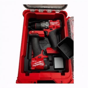 May include: A white ceramic mug with a black handle and the text "But First, Coffee" in a bold, black font. The mug is sitting on a wooden surface. The mug is approximately 4 inches tall.