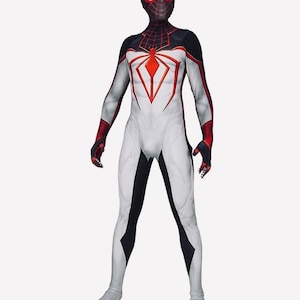 May include: A superhero costume in white, black, and red. The suit has a spider emblem on the chest and a mask with red eyes. Red accents are on the arms and legs, with black detailing on the shoulders and sides. The costume is designed to cover the entire body.