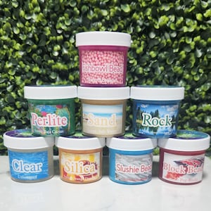 May include: Eight small jars of slime with different colors and textures. The jars are labeled with the names of the slime types, such as "Fishbowl Bead", "Perlite", "Sand", "Rock", "Clear", "Silica", "Slushie Bead", and "Block Bead".