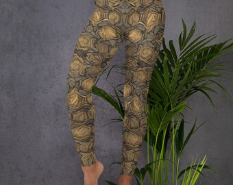 May include: Brown and gold leggings with a geometric pattern. The leggings are made of a stretchy, comfortable fabric and are perfect for yoga, running, or everyday wear.