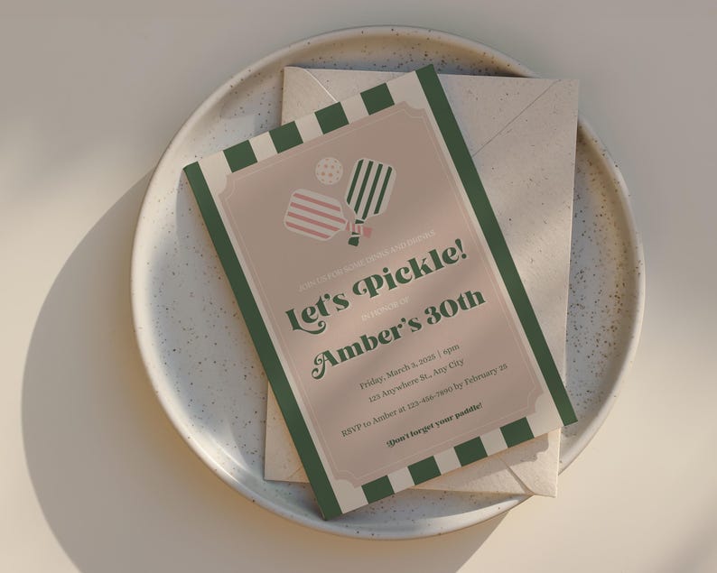May include: A green, white, and pink invitation card with a striped pattern. The card reads "Let's Pickle! Amber's 30th" and includes details for a pickleball party.