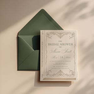 May include: A bridal shower invitation designed to look like a book, with the text "The Bridal Shower of Alexa Scott" and the date March 14, 202x. The invitation is paired with a dark green envelope, set against a neutral background.