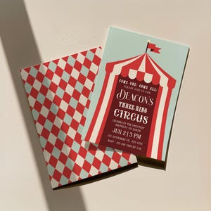 May include: A red and white striped circus tent invitation with the text "Come one, come all. Please join us for Deacon's Three-Ring Circus. Celebrate the greatest birthday on Earth. Jun 2 13 PM. 123 Anywhere St. Any City. RSVP 123-456-7890 by 5:00 PM."