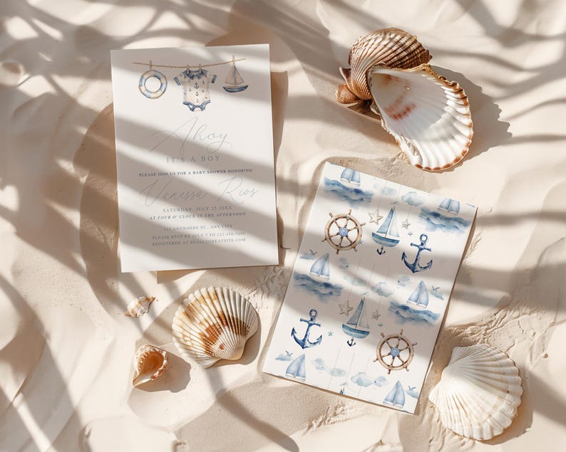May include: Baby shower invitation with nautical theme. The invitation features the text "Ahoy It's a Boy" and a watercolor illustration of a sailboat, life preserver, and baby clothes. A patterned card with sailboats, anchors, and steering wheels is also present.