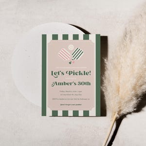 May include: A green and white striped invitation with a pink and green pickleball paddle graphic. The text reads "Let's Pickle!" and "Amber's 30th".