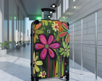 May include: A black suitcase with a colorful floral design. The suitcase has a retractable handle and four wheels.