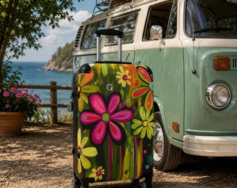 May include: A hard-shell rolling suitcase featuring a vibrant, multi-colored floral pattern with large pink, yellow, and green flowers against a dark background. The luggage has a retractable silver handle, four black spinner wheels, and a logo.