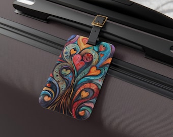 May include: A rectangular luggage tag featuring a vibrant, abstract design of swirling lines and multiple heart shapes in shades of red, orange, teal, and blue. The tag is attached to a dark brown suitcase handle by a black strap with a gold buckle.