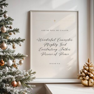 May include: A framed print with the text "AND HE WILL BE CALLED" and "Wonderful Counselor, Mighty God, Everlasting Father, Prince of Peace, Isaiah 9:6." A Christmas tree with baubles and a gold pinecone decoration are also visible.