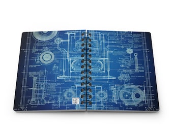 May include: Open spiral-bound notebook featuring a blueprint design. The pages show a detailed technical drawing in white against a blue backdrop. The notebook is open, displaying the intricate design.