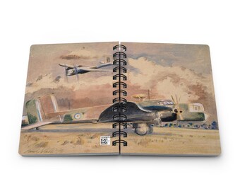 May include: Spiral-bound notebook featuring a watercolor painting of two vintage airplanes in flight. The primary aircraft is a multi-engine bomber, painted in camouflage colors, with a second plane in the background. The artwork has a vintage aesthetic.