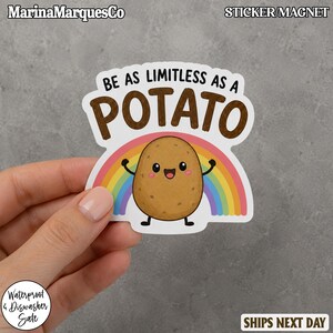 May include: A die-cut sticker or magnet featuring a cartoon potato with a smiling face and raised arms. Behind the potato is a colorful rainbow. The text above reads BE AS LIMITLESS AS A POTATO in black and brown capital letters.