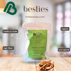 May include: A bag of sweet potato dog treats with the brand name "Besties" and the tagline "Dog Treats". The bag is on a wooden surface with a green heart logo and the text "forbesties.com". The bag is labelled "organic", "high fibre", "low calorie", and "made to order".