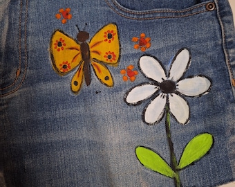Hand painted boho daisy duke shorts.