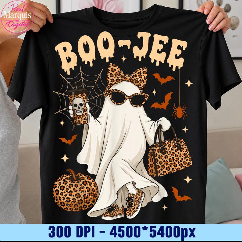 May include: A black t-shirt featuring a graphic of a ghost wearing leopard print sunglasses, a matching bow, and sneakers. The ghost holds a leopard print cup with a skull and a leopard print handbag. A pumpkin, bats, and spiderwebs surround it.