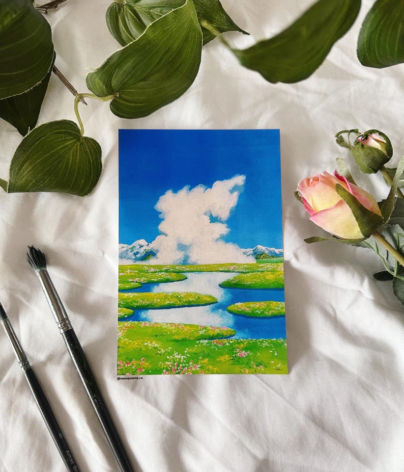 May include: A watercolor painting of a landscape with a large white cloud in a blue sky, a green field with a winding blue river, and snow-capped mountains in the distance.