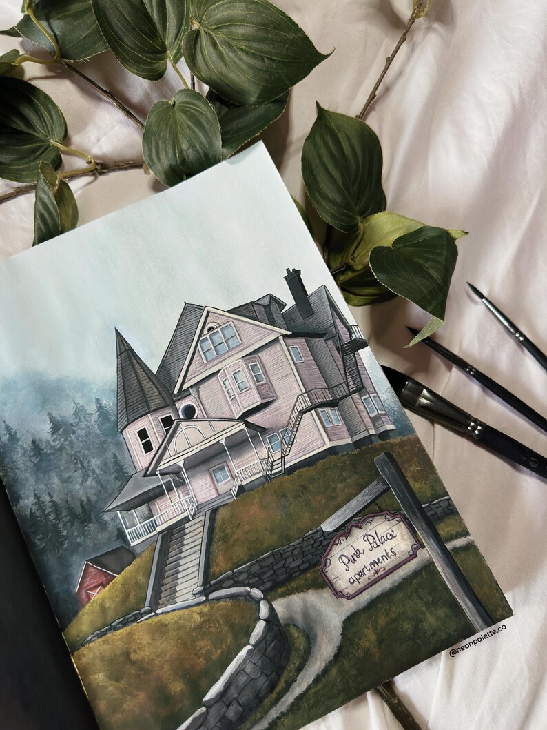 May include: A watercolor painting of a pink house with a sign that reads "Pink Palace Apartments". The house is on a hill with a stone wall and a path leading up to it. The painting is surrounded by green foliage.