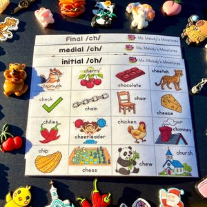 May include: A speech therapy worksheet titled initial /ch/, medial /ch/, and final /ch/ by Ms. Melody's Miniatures, featuring a grid of illustrations and words like chipmunk, cherry, chocolate, cheetah, check, chain, chair, cheese, chilies, cheerleader, chicken, chimney, chip, chess, chew, and church, surrounded by various colorful miniature charms.