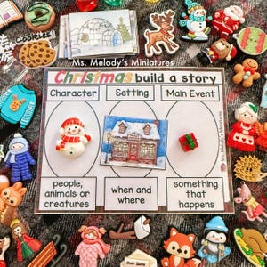 May include: A Christmas-themed educational activity set with miniature figurines and a story-building board. The board features sections for character, setting, and main event. Includes a snowman, a Santa's workshop illustration, and a wrapped gift.