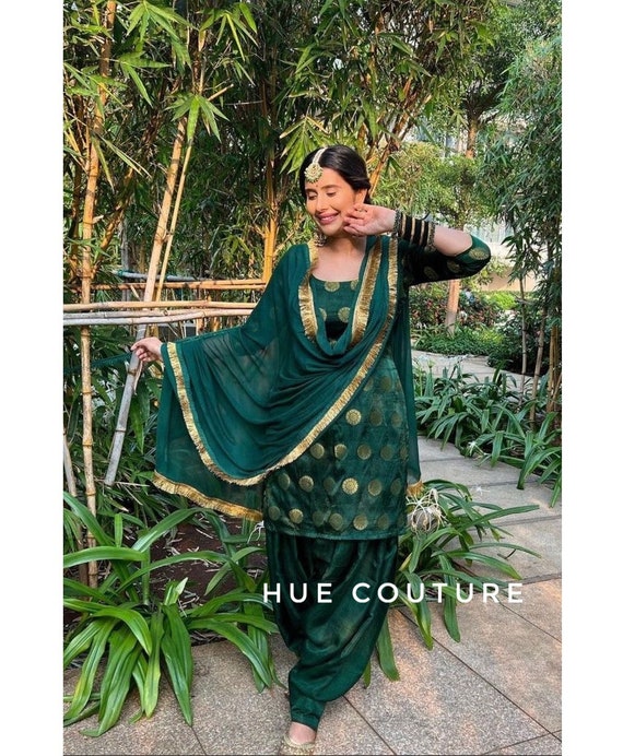 Most Demanding Dark Green Color Net Festive Salwar Suit