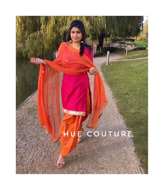 Orange punjabi suit deals