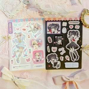 Sticker sheets of Ame and KAngel from Needy Streamer Overload