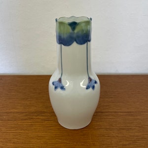 Vintage porcelain vase with blue-green floral decoration