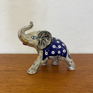 Painted vintage elephant figurine made of ceramic in grey and blue