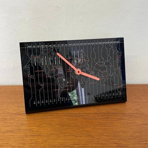 Table clock with time zones made of plastic in black with red 70s Mid Century Vintage