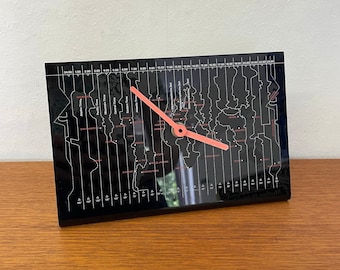 Table clock with time zones made of plastic in black with red 70s Mid Century Vintage