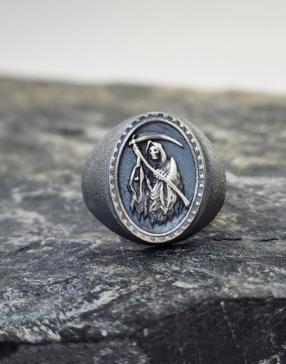 Grim Reaper With Sickle Black Impressed Skull and Hatchet