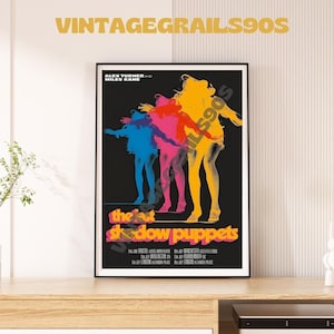 May include: A vintage movie poster for the film "The Last Shadow Puppets" featuring a black background with four colorful silhouettes of women in a dancing pose. The text "Alex Turner and Miles Kane" is at the top of the poster, and the title of the film is in large, white letters.