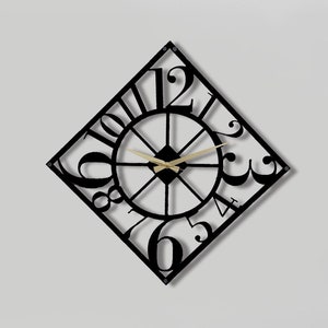 May include: A black metal wall clock with Roman numeral hour markers in a diamond shape. The clock has a gold-coloured hour and minute hand. The clock is hanging on a white wall above a brown leather sofa.