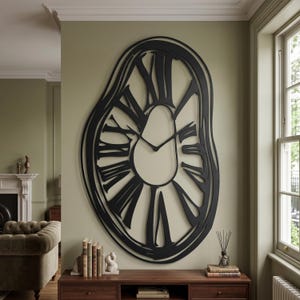May include: A large, black, wall-mounted clock with an irregular, melting, or distorted oval shape. It features elongated Roman numerals arranged around a central open space, with two thin, black clock hands positioned in the centre of the frame.