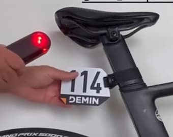 Race number adapter for garmin varia holder