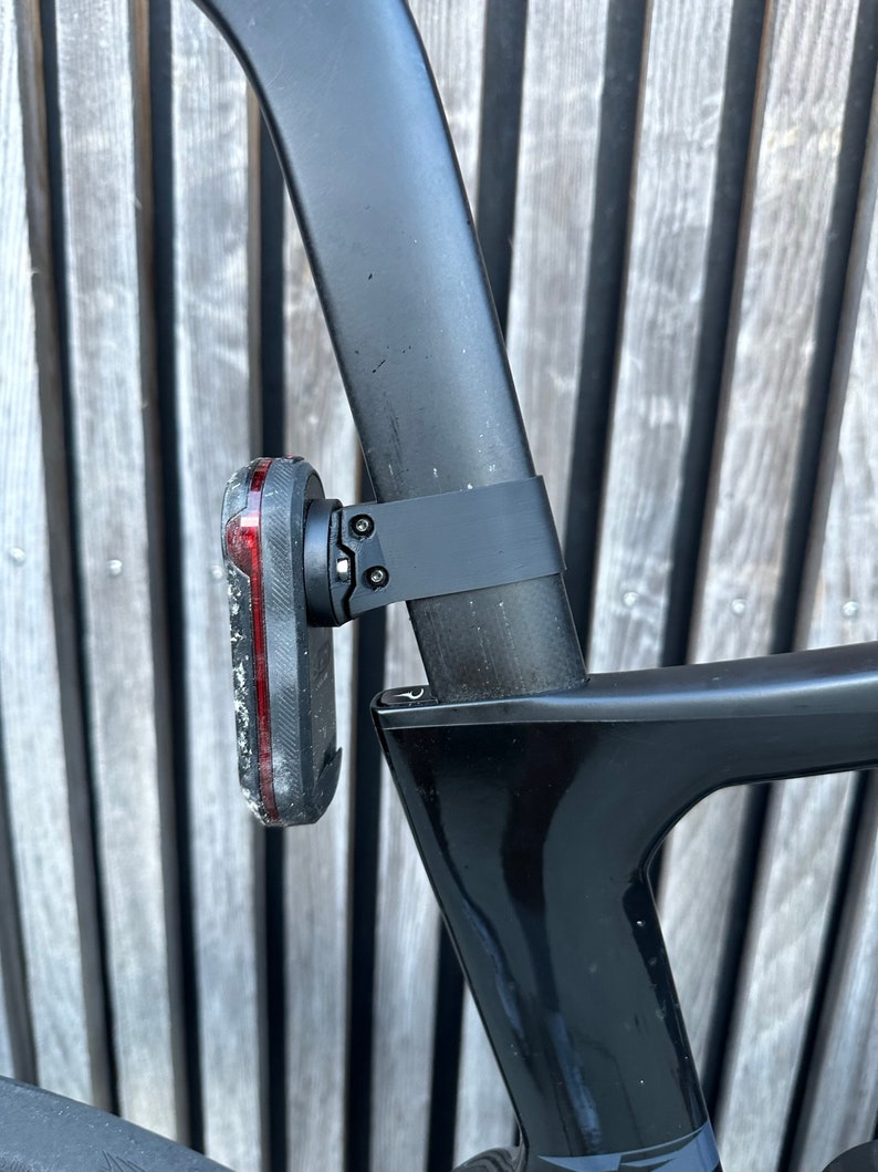 Garmin Varia 300/500 series aero seatpost mounts. Pinarello Dogma F