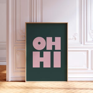 May include: A framed poster with a dark green background and the words "OH HI" in pink.
