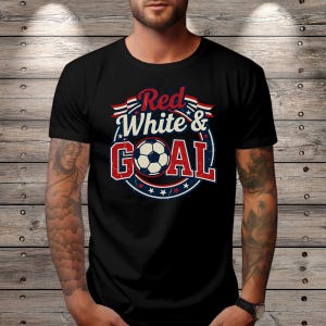 May include: Black t-shirt with a soccer ball graphic. The design features the words "Red White & GOAL" in red and white, with a soccer ball in the center. The design is surrounded by a blue circle with stars.