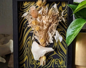 Black frame decorated with sea urchins and golden ornaments | Curiosity cabinet