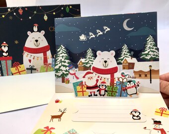 Handmade paper popup 3D glitter blue Christmas greeting card- Merry Christmas night tree reindeer sleigh snowman penguins Santa presents.