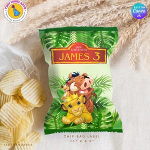 May include: A chip bag label featuring characters from The Lion King. The design includes Simba, Timon, and Pumbaa, with the text "OUR LITTLE KING JAMES 3". The label is 27.9 cm by 21.6 cm, with a green and gold color scheme.
