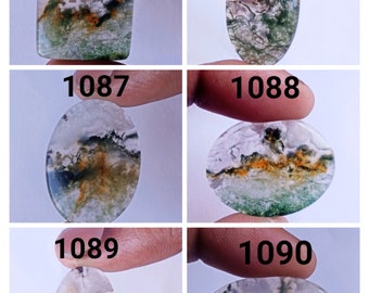 May include: Five oval and rectangular shaped green, white, and brown agate cabochons. The cabochons are numbered 1085, 1086, 1087, 1088, and 1090.