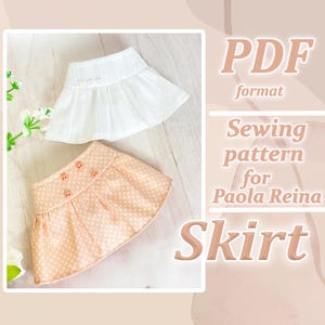 Puede incluir: Patrón de costura PDF para muñecas Paola Reina. El patrón incluye dos diseños de faldas: una falda blanca con un dobladillo con volantes y una falda melocotón con lunares blancos.